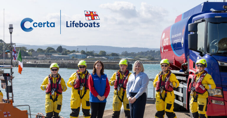Certa fuel tanker beside an RNLI lifeboat with RNLI crew on the pier